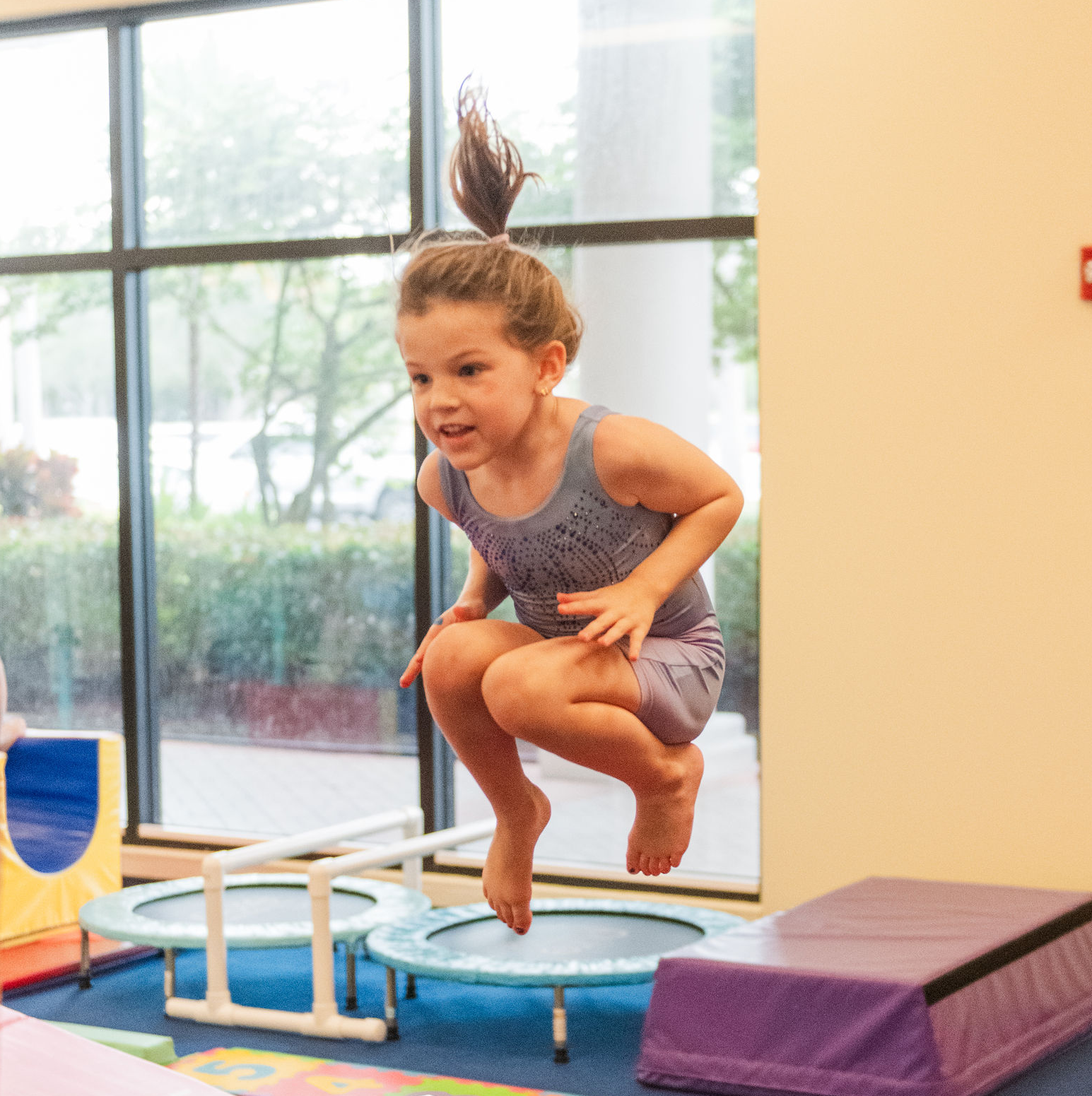 Student doing a tuck jump.